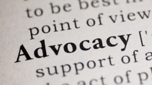 Advocacy on grey background with other words